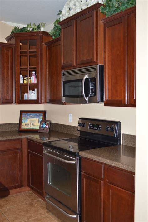 mocha or mahogony cabinets with stainless steel appliances|stainless steel kitchen cabinets.